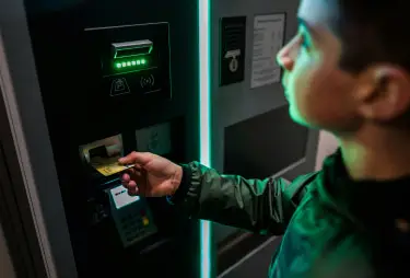 bancnet man inserting card into bancnet atm for secure banking transactions