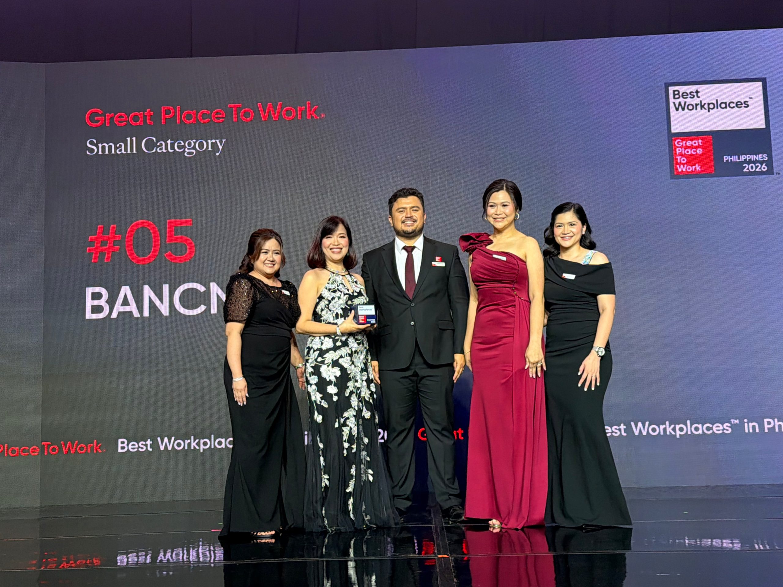 BancNet CEO Emmie Reyes and members of the Human Resources and Admin Division (HRAD) receive the Best Workplaces™ Philippines 2026 award. Belle Lobitana (BancNet Talent & Organization Development Officer), Emmie Reyes (BancNet CEO), Charles Plumley (Great Place to Work Philippines General Manager), Polly Austria (BancNet HRAD Head) and Jao Burgos (BancNet HR Officer).